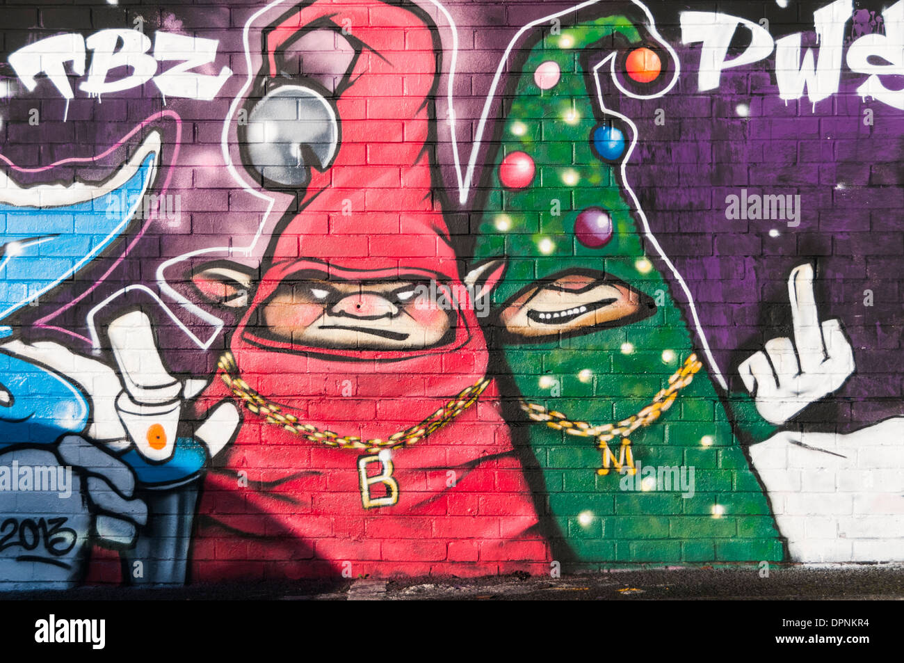 Colourful christmas themed graffiti on the wall of a town centre