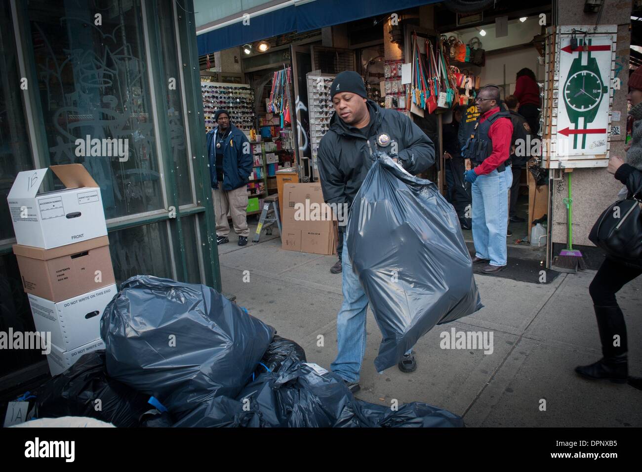 vendor illegally selling imitation name brand handbags on Canal Street  Manhattan New York Stock Photo - Alamy