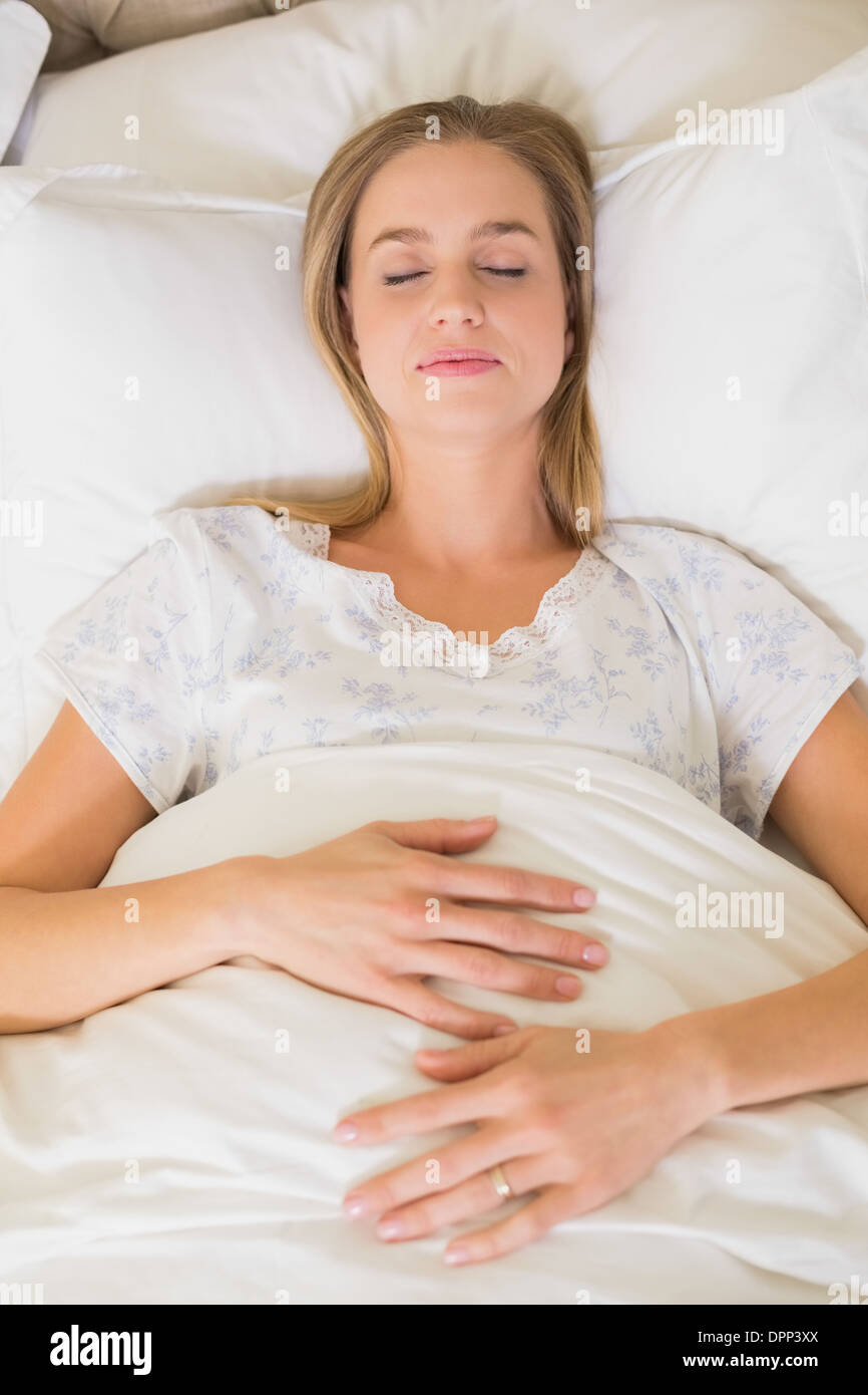 Natural peaceful woman slumbering in bed Stock Photo