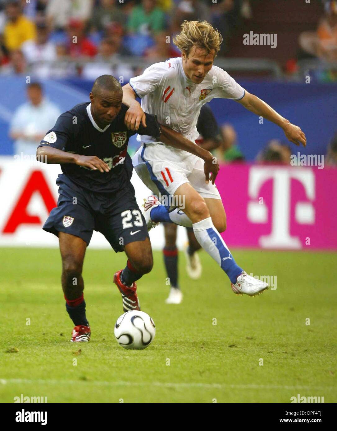 Alexi Lasas of the New England Revolution and Eddie Pope of D.C.