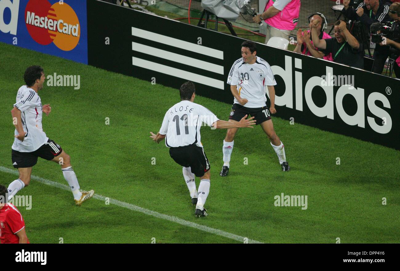 June 14, 2006 - World Cup Stadium, dDORTMUND, GERMANY - OLIVER NEUVILLE , MIROSLAV KLOSE & MICHAEL BALLACK CELEBRATE..WINNER..GERMANY V POLAND....NEUVILLE ,KLOSE &  BALLACK..GERMANY V POLAND.(Credit Image: © Globe Photos/ZUMAPRESS.com) Stock Photo