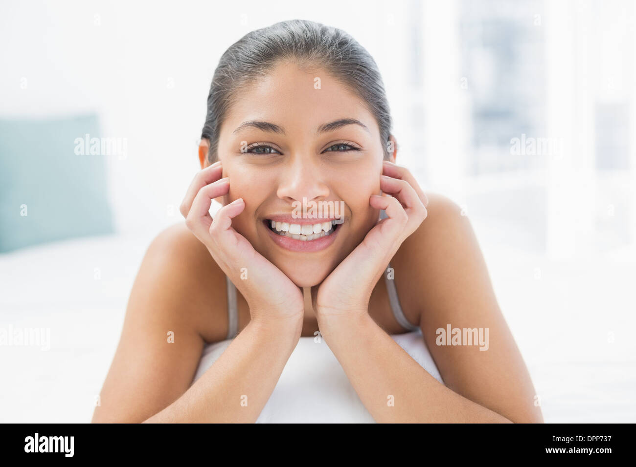 Portrait of a pretty woman lying in bed Stock Photo Alamy