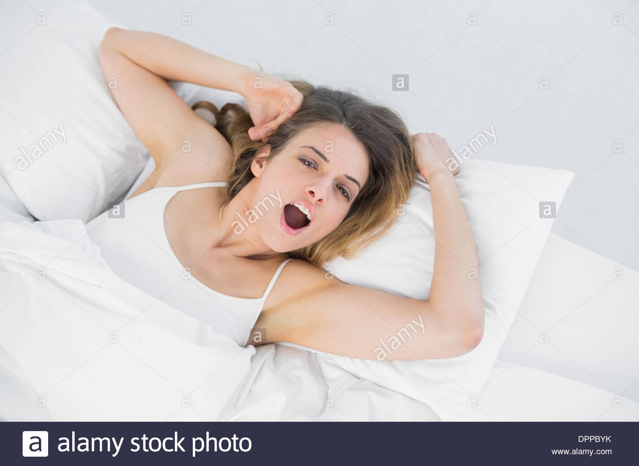 Girl lay on stomach. Спальня спят. She in bed. Лежание на кровати. Девушка зевает.