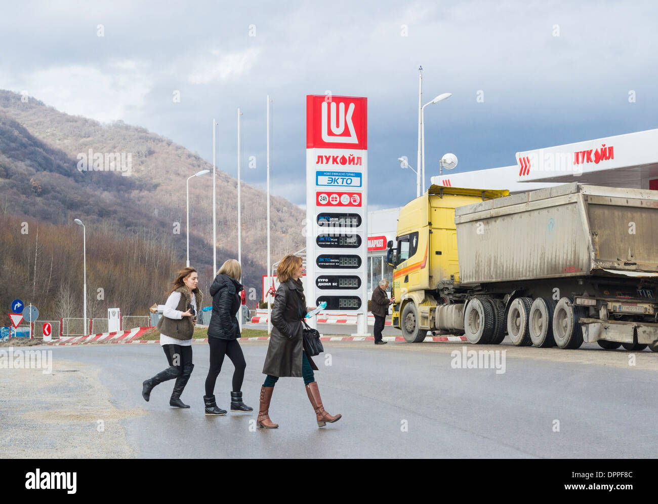 Women crossing the street - Straja halt on a mountain gorge on the road between Skopje and Ohrid, Macedonia / FYROM Stock Photo