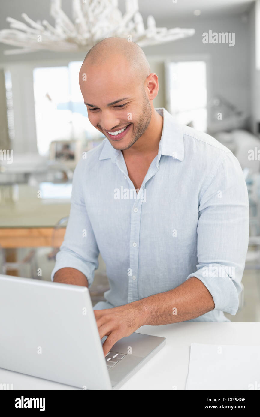 Happy handsome bald man using hi-res stock photography and images - Alamy