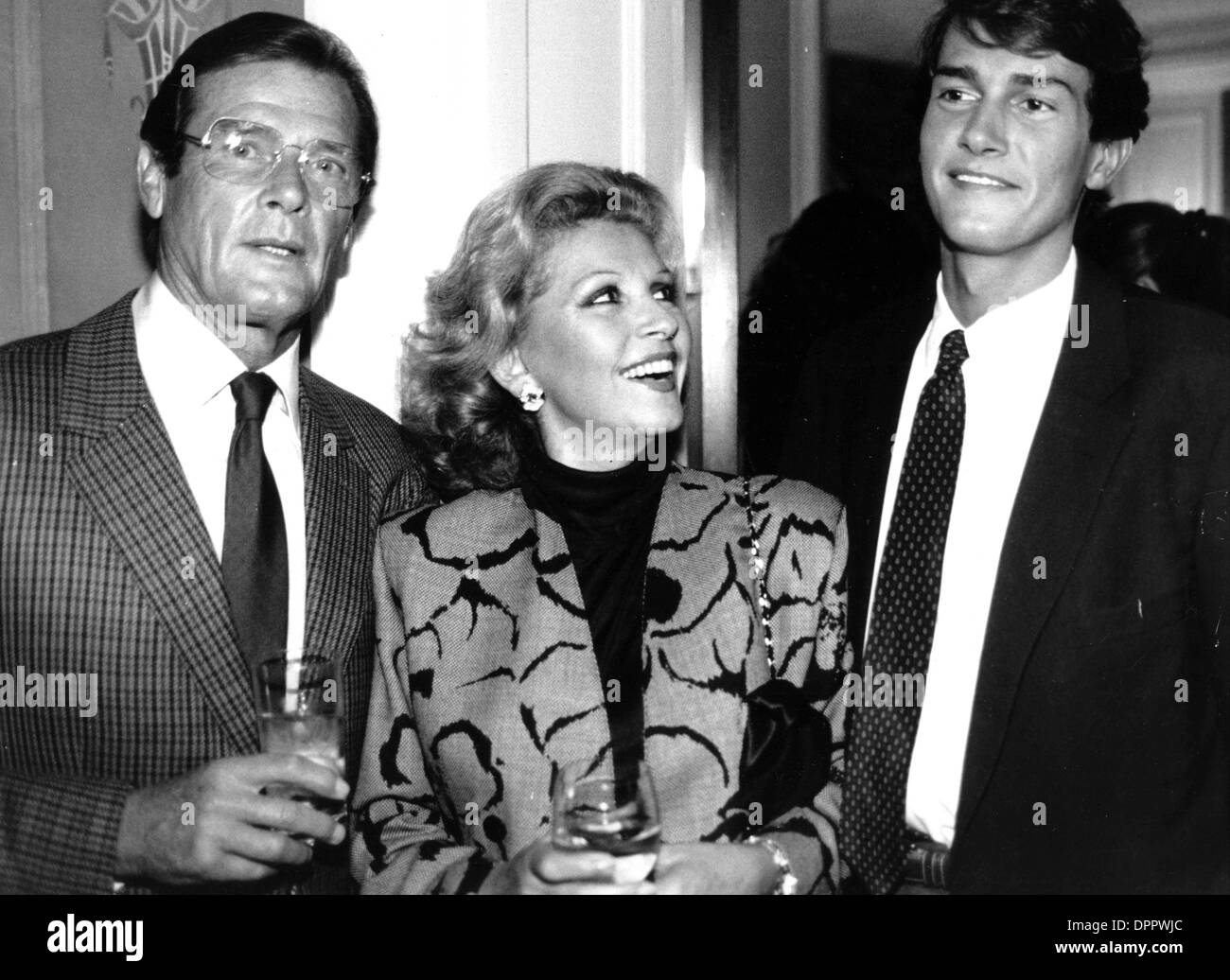 Mar. 30, 2006 - ROGER MOORE WITH WIFE LUISA AND SON GEOFFREY.   PHOTOS(Credit Image: © Globe Photos/ZUMAPRESS.com) Stock Photo