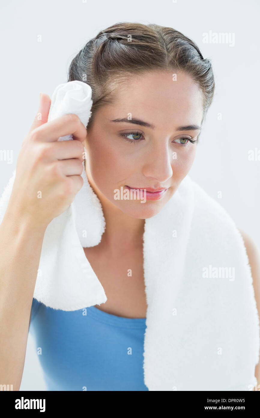 Woman wiping sweat with towel Stock Photo Alamy