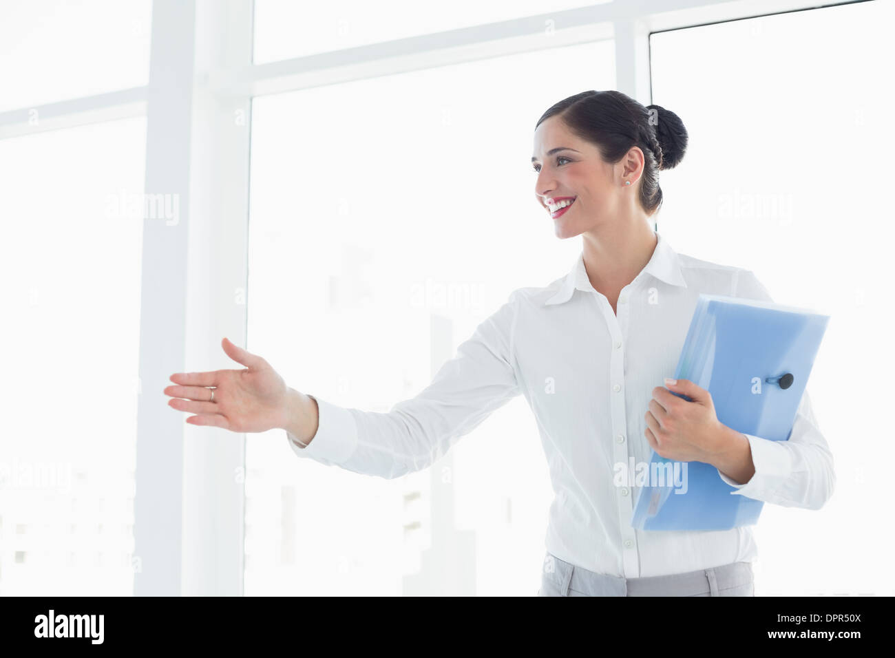 Business woman with folder entering office cabin Stock Photo