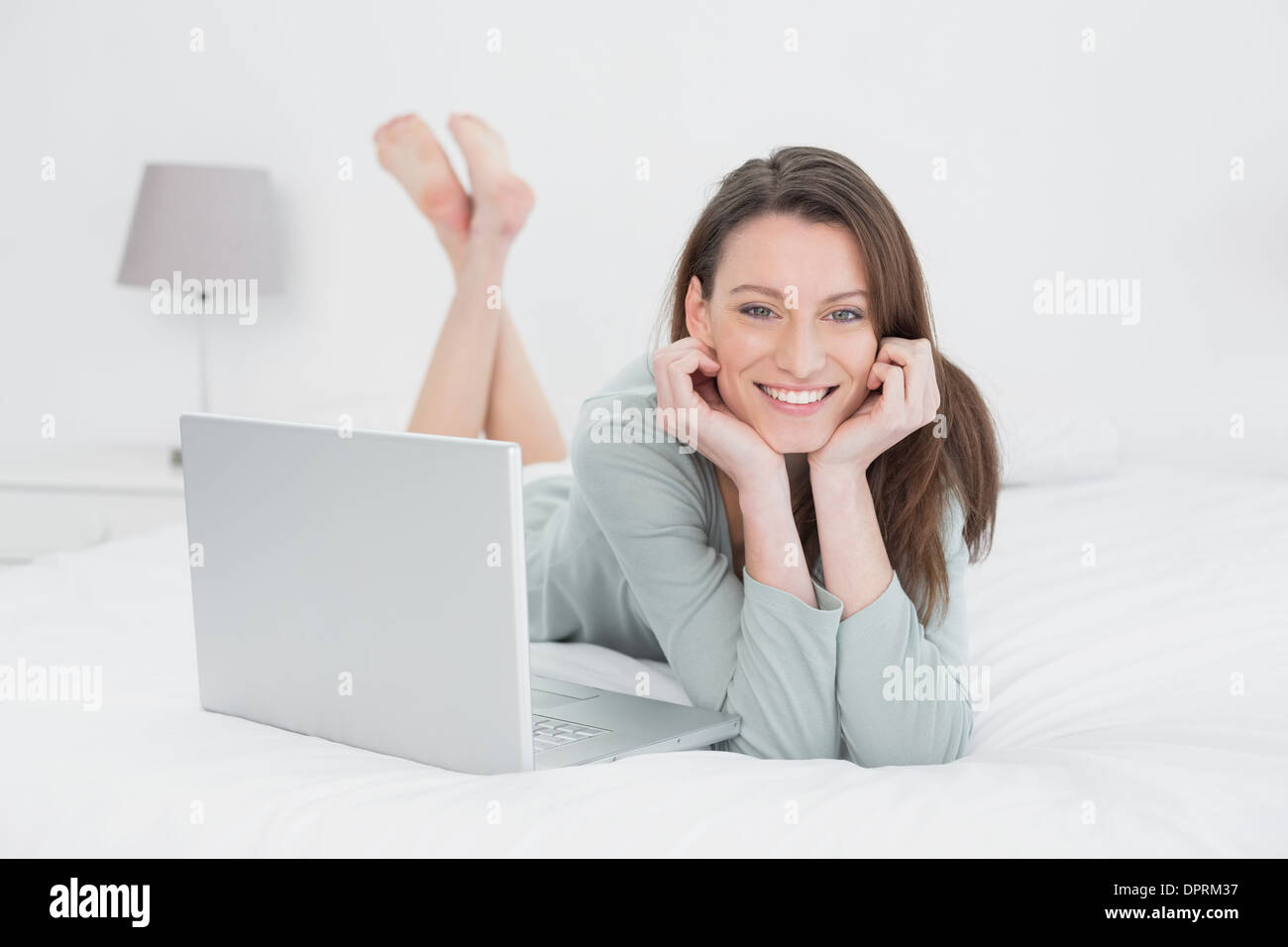 Relaxed woman lying in bed hi-res stock photography and images - Alamy