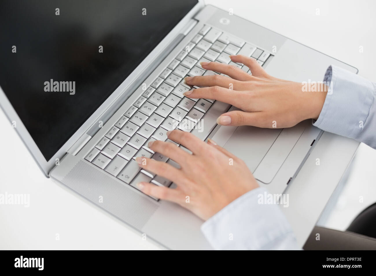 Close up of hands using laptop Stock Photo