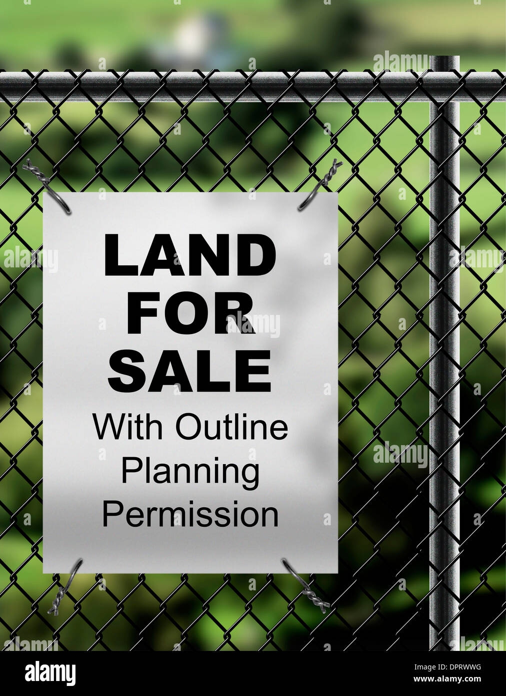 Land For Sale by with Outline Planning Permission  sign fixed on wire fencing. Stock Photo