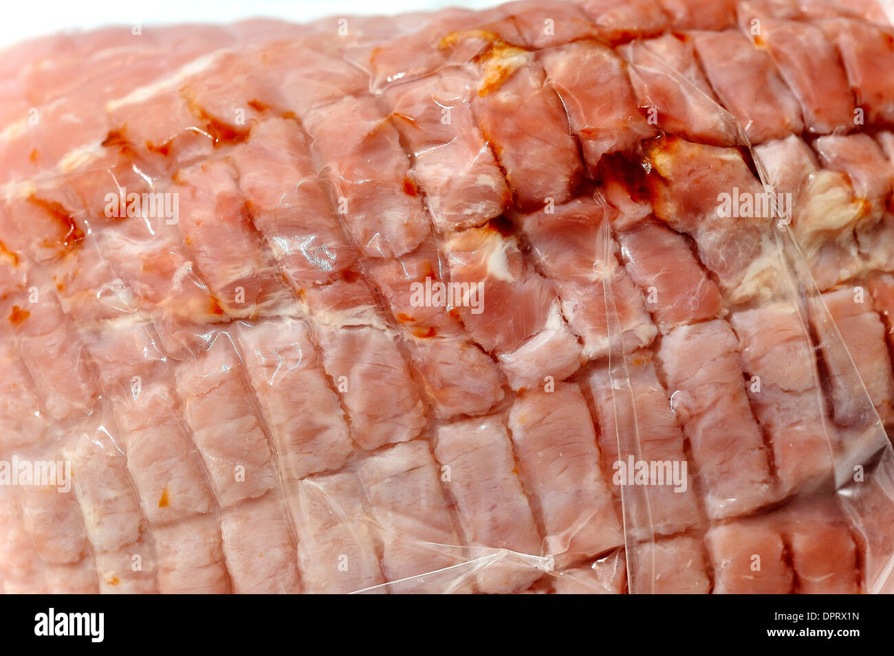 vacuum packed joint of cooked ham Stock Photo Alamy