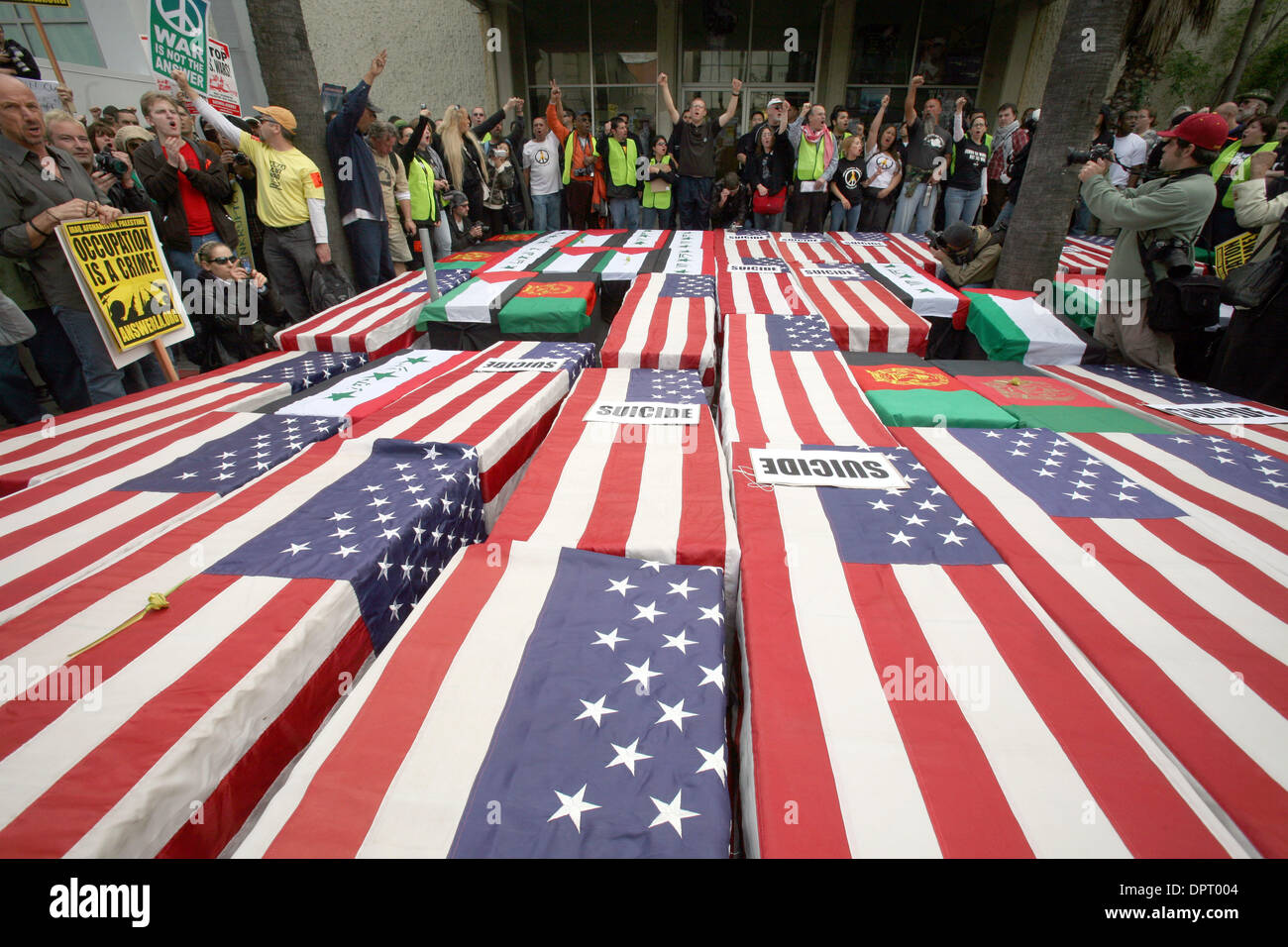 Mar 21, 2009 - Hollywood, California, USA - Anti-war activists place the mock coffins to the front door of the Armed Forces Recruitment Center during a march in Hollywood to protest the 6th anniversary of the US war in Iraq, March 21, 2009. (Credit Image: © Ringo Chiu/ZUMA Press) Stock Photo