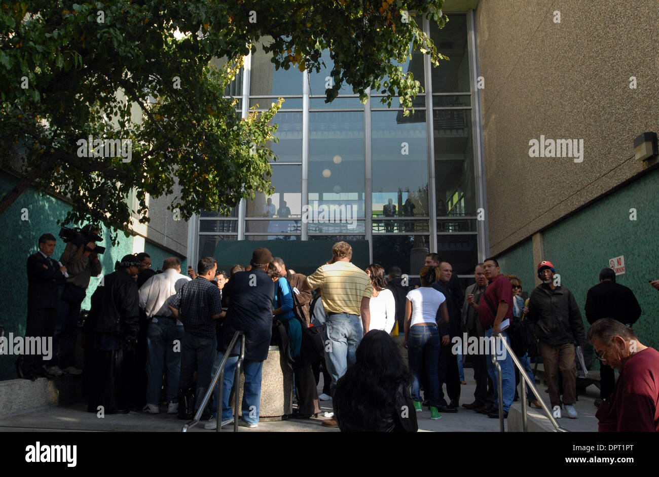 Media crowd around prosecutor Angela Hayes at the entrance to the San ...