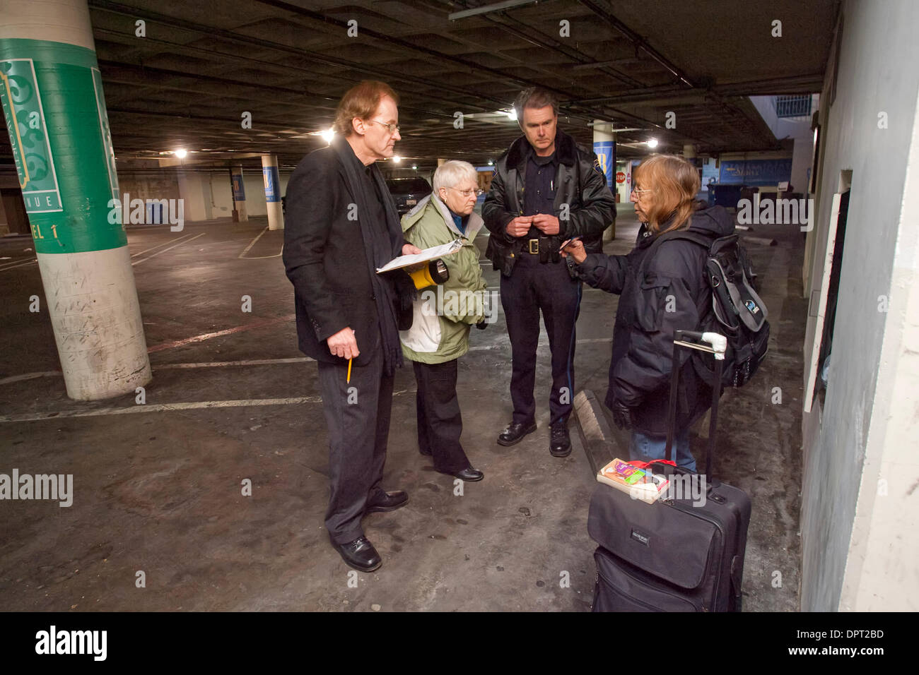 San Mateo County Supervisor's Mark Church, left, and Carole Groom along with San Mateo police officer Robert Anderson talk with Irene(does not want last name used) in a parking garage, in San Mateo,Calif., Thursday, January 29, 2009. Volunteers and county officials conducted a count of the homeless in the city early Thursday morning..(John Green/Staff) Stock Photo