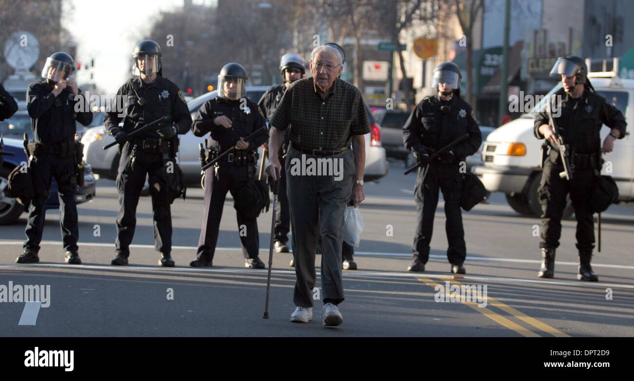 Walks past riot police after hi-res stock photography and images - Alamy
