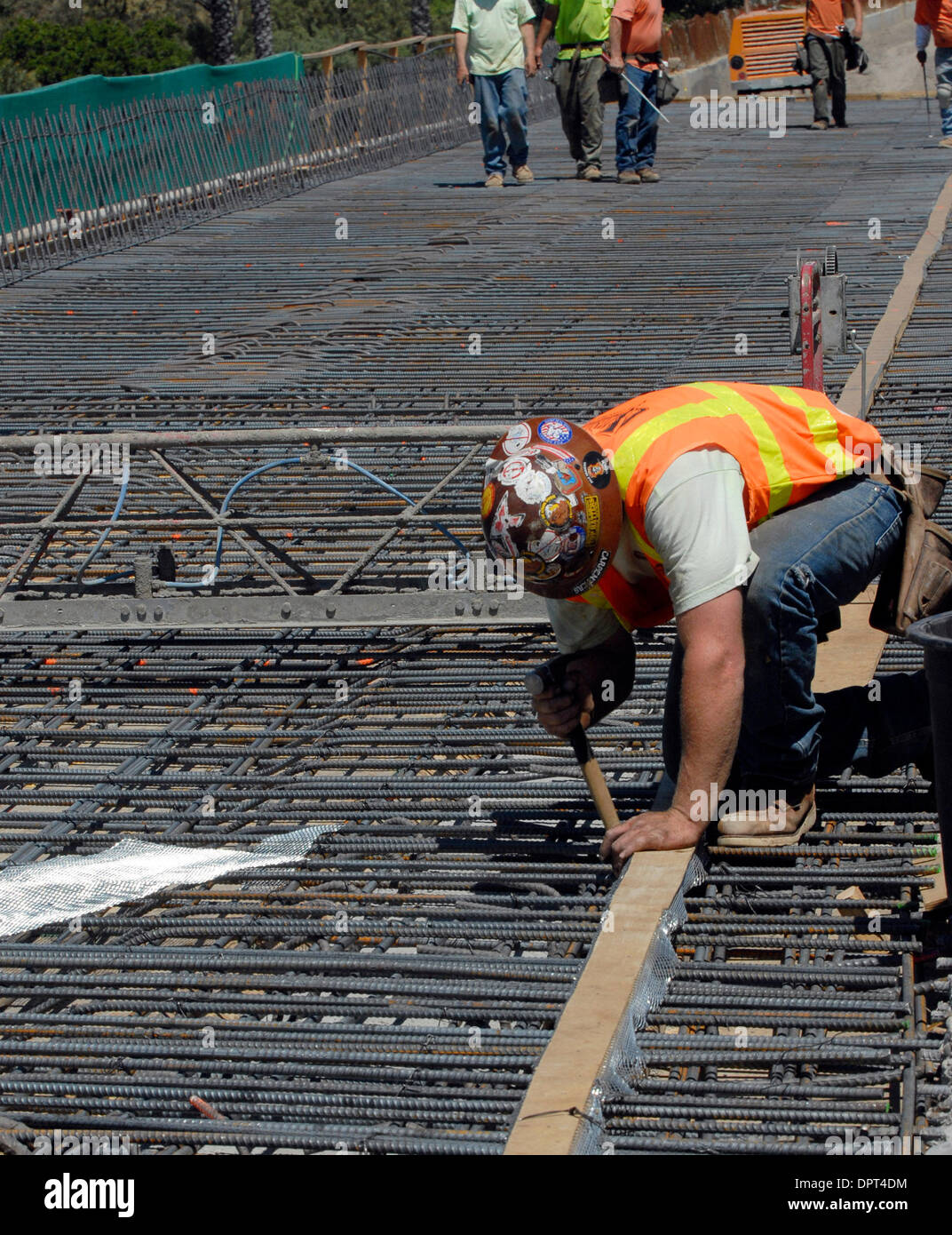 Brian Merryman works on a bridge over Mission Boulevard (238) along Interstate 680 in Fremont, Calif., on Monday, April 20, 2009. The freeway is being widened to create High Occupancy Toll lanes that will allow non-carpool drivers to pay via transponder to access the lane. Those who carpool will continue to use the lane for free. (Cindi Christie/Staff) Stock Photo