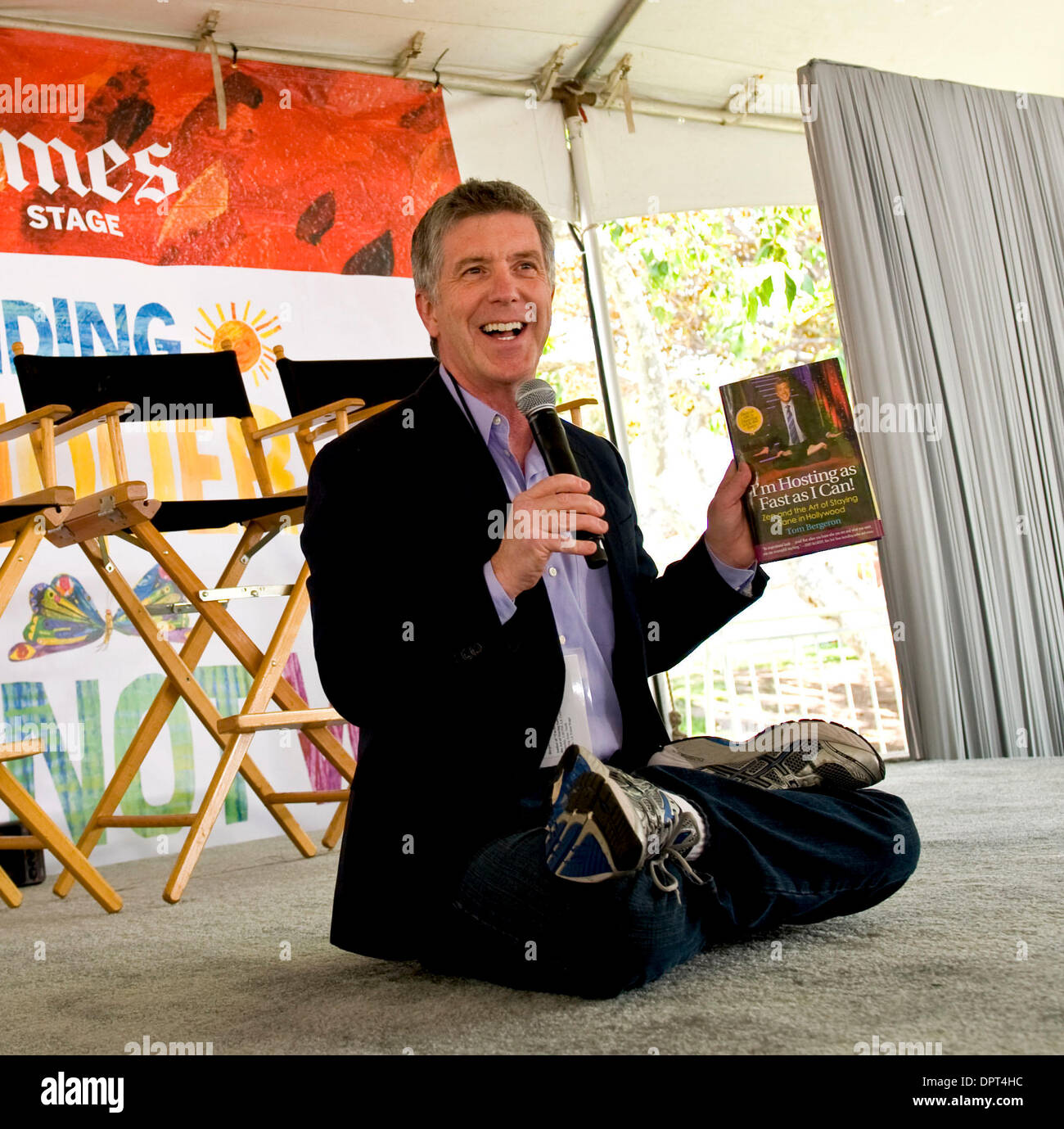 April 25, 2009 - Los Angeles, California, USA - TOM BERGERON, host of 'Dancing With the Stars,' briefly assumes the lotus position to speak about his book 'I'm Hosting As Fast As I Can: Zen and the Art of Staying Sane in Hollywood,' at the Los Angeles Times Festival of Books on the campus of the University of California at Los Angeles. (Credit: © Brian Cahn/ZUMA Press) Stock Photo