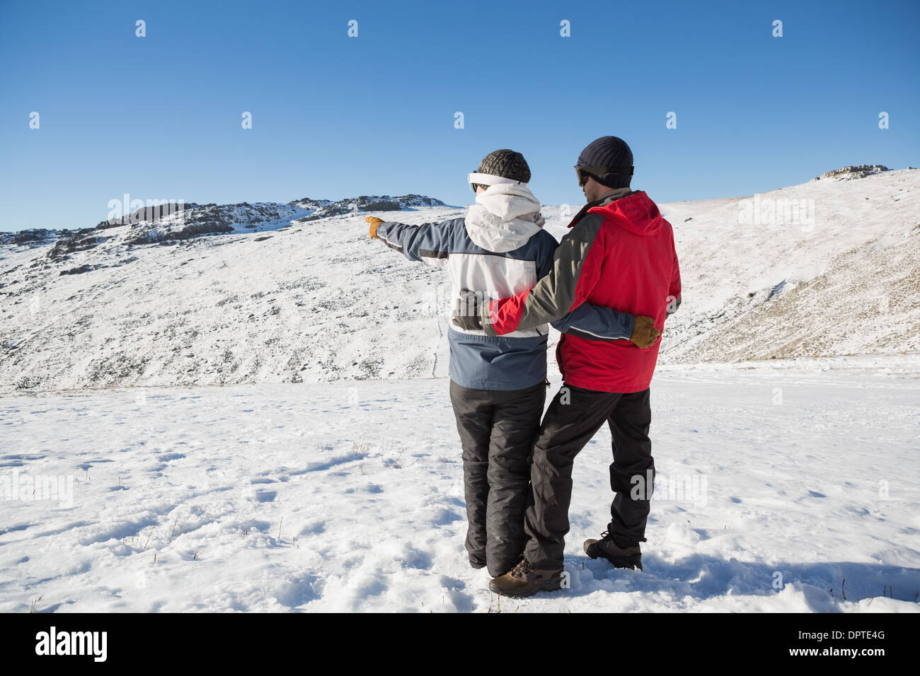 Romantic couple snow rear view hi-res stock photography and images - Alamy