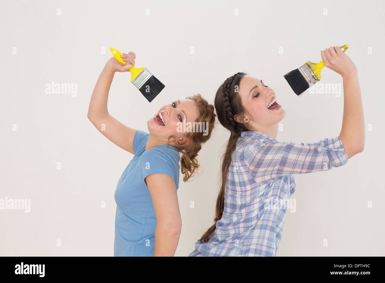 Singing into brush hi-res stock photography and images - Alamy