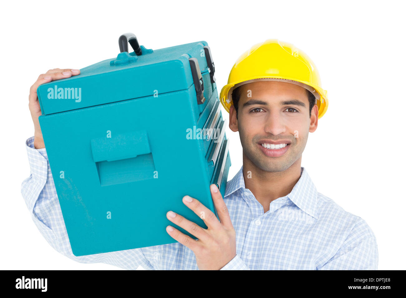Smiling handyman in hard hat carrying a toolbox Stock Photo