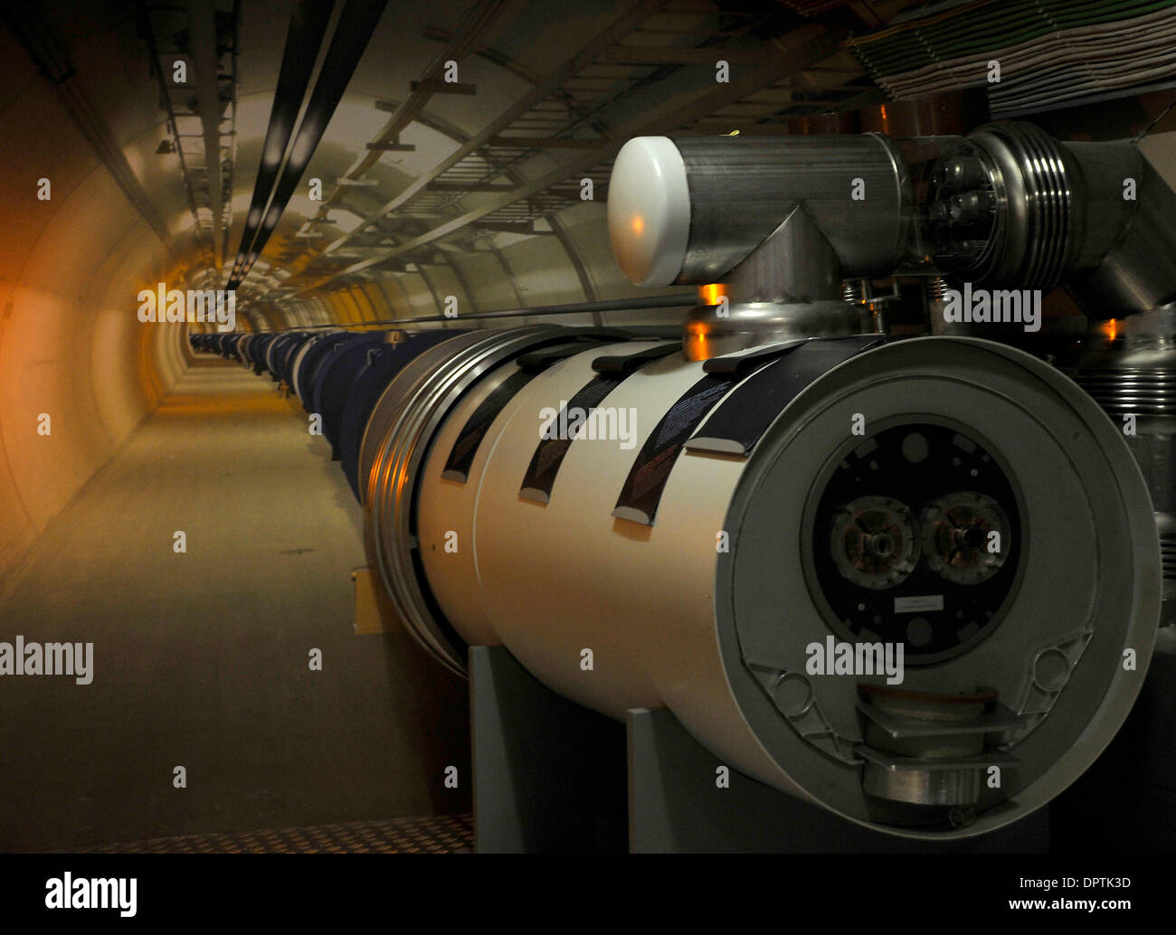 Jan 12, 2009 - Geneva, Switzerland - A photograph shows visitors what the LHC tunnel looks like in the visitors centre at CERN. Access to the actual tunnel is restricted as the superconductor magnets shown are cooled to -271 degrees celcius. CERN ( the European Centre for Nuclear Research) developed the Large Hadron Collider (LHC) to carry out research into high energy particle col Stock Photo