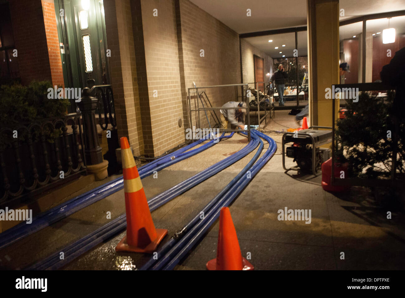 New York, USA. 15th January 2014. Workers pump water from the flooded basement of the