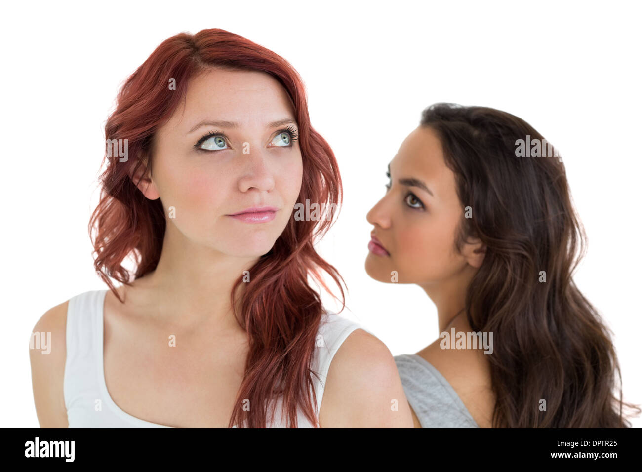 Unhappy young female friends not talking after argument Stock Photo