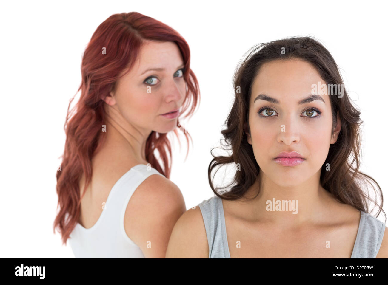 Unhappy young female friends not talking after argument Stock Photo