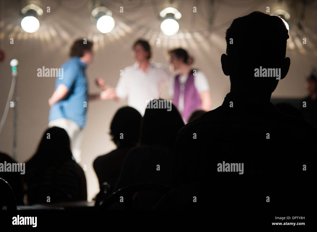 Silhouette of the audience watching acts at Aberystwyth university students union comedy club fringe night, Wales UK Stock Photo