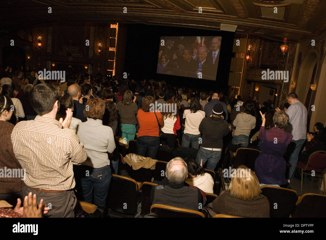 Jan 20, 2009 - Seattle, Washington, USA - Over 2500 people turned out to watch a large TV screen at the Paramount Theatre in Seattle, WA. It was standing room only in the venue as Barack Obama was sworn in as the 44th president of the United States. (Credit Image: © Daren Fentiman/ZUMA Press) Stock Photo