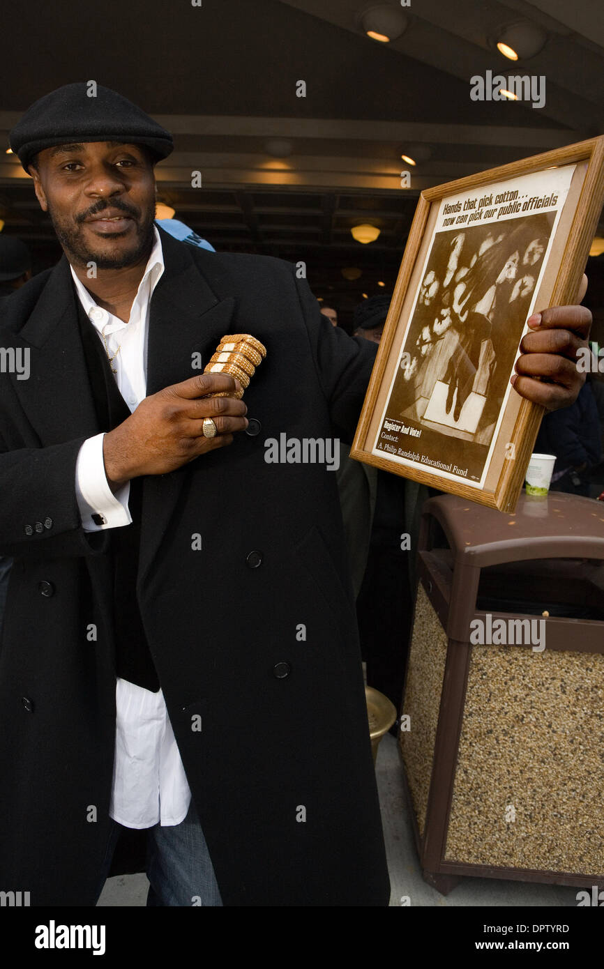 Jan 20, 2009 - Seattle, Washington, USA - People wait outside of the Paramount Theatre in Seattle, here JOHN F JENKINS from Mississippi holds a cotton bail showing 'how far we have come as a nation.' Over 2500 people turned out to watch a large TV screen at the Paramount Theatre in Seattle, WA. It was standing room only in the venue as Barack Obama was sworn in as the 44th presiden Stock Photo