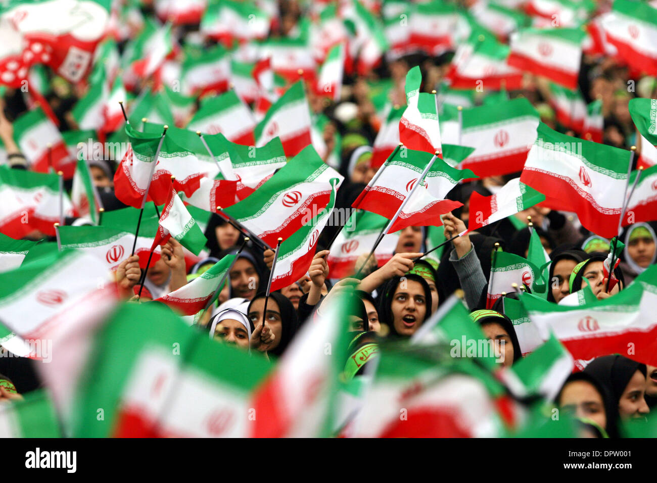 Feb 10, 2009 - Tehran, Iran - Iranian schoolgirls hold Iranian national flags as they attend a rally marking the 30th anniversary of Iran's Islamic Revolution at the Azadi (freedom) Square in Tehran, Iran. (Credit Image: © Hossein Fatemi/ZUMA Press) Stock Photo