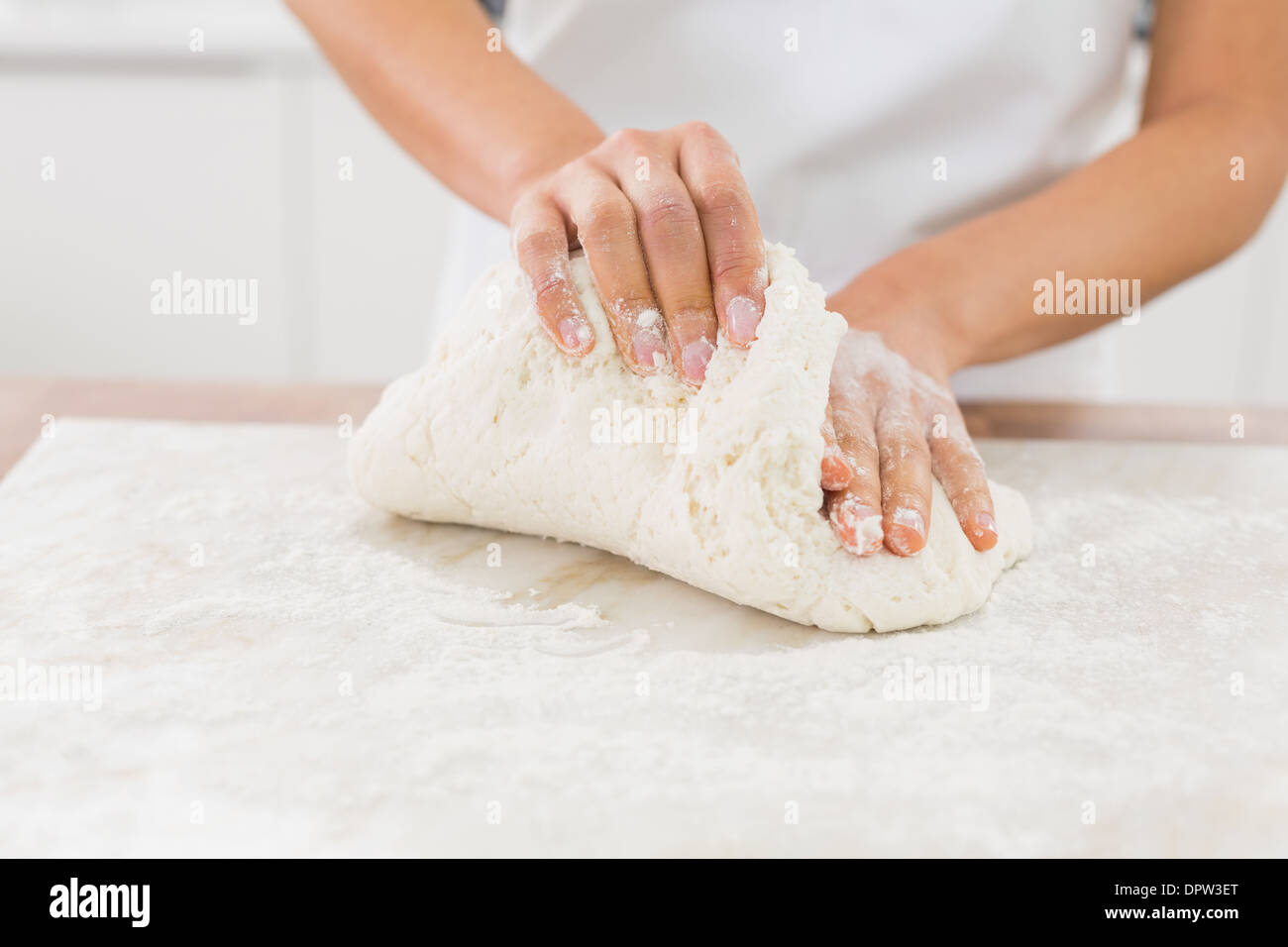 Woman kneading dough in flour hi-res stock photography and images - Alamy