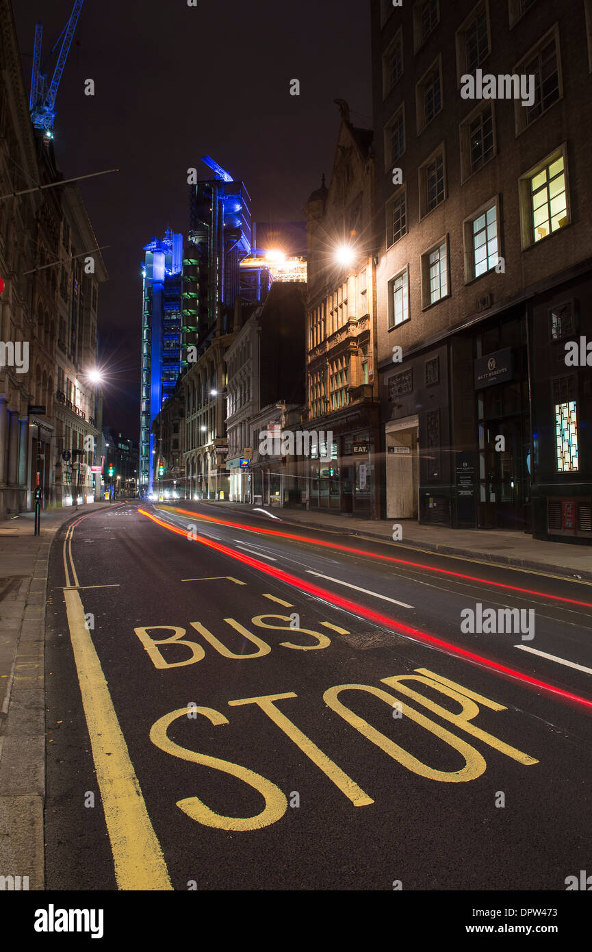 Bus stop and road leading to the famous Lloyds Building in the City of London, England. Stock Photo