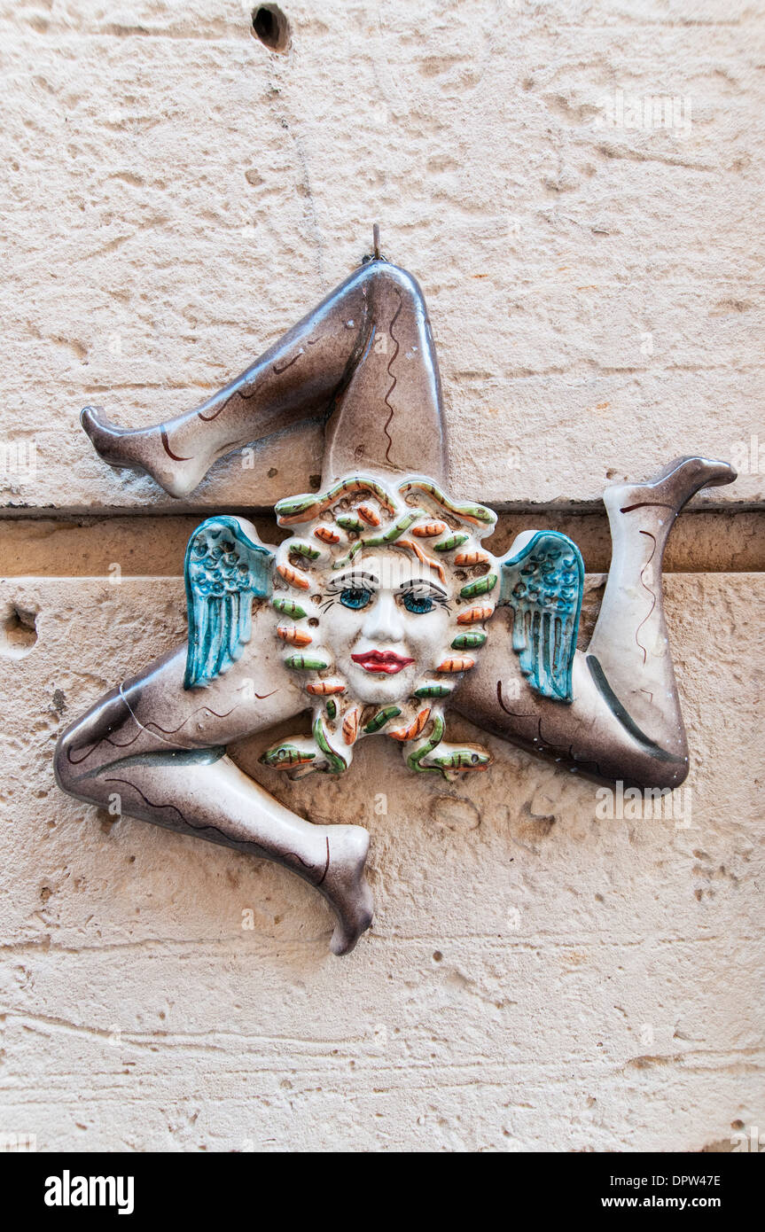 Italy, Sicily, Syracuse: The Trinacria, a woman's head with snakes surrounded by three legs), the Sicilian emblem Stock Photo