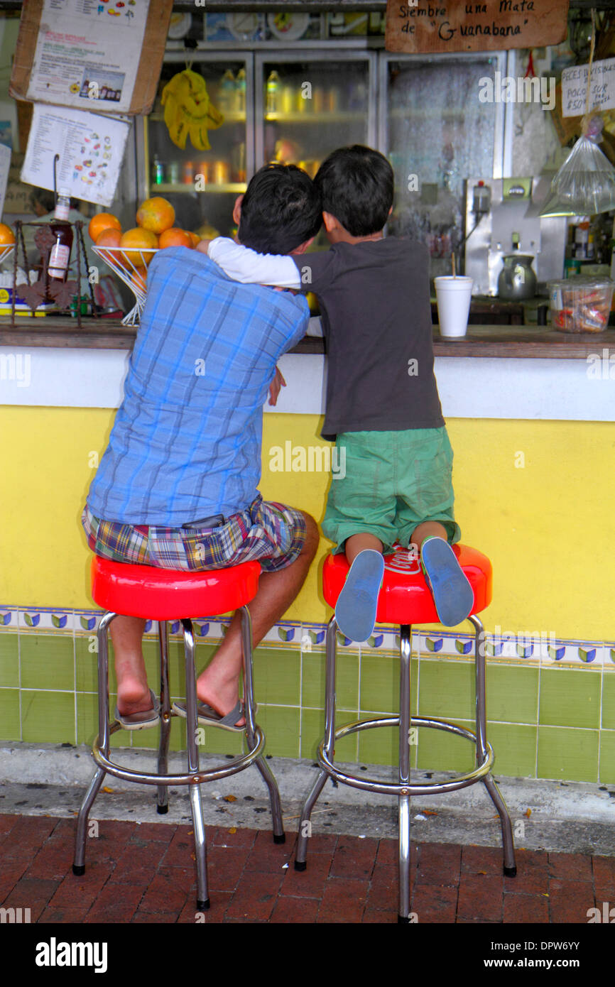 Miami Florida,Little Havana,Calle Ocho,cafe,restaurant restaurants food dining cafe cafes,counter,stools,man men male,father,boy boys,male kid kids ch Stock Photo