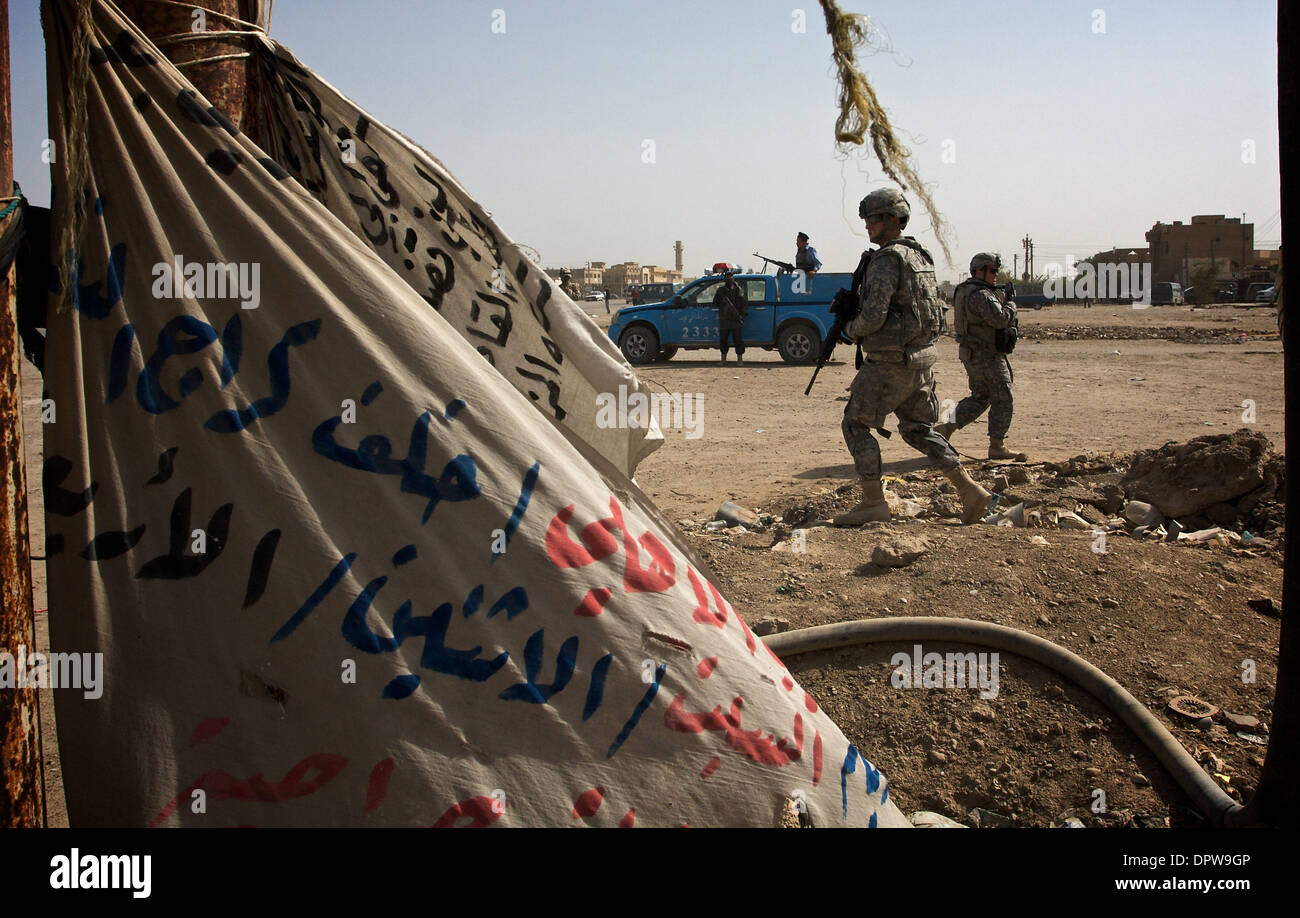 March 16, 2009 - Baghdad, Iraq - US National Guard 56th Infantry Briggade patrols the Abu Ghraib neighborhood while Iraqi National Police (left) wait in their truck.  (Credit Image: © John Goodman / ZUMA Press) Stock Photo