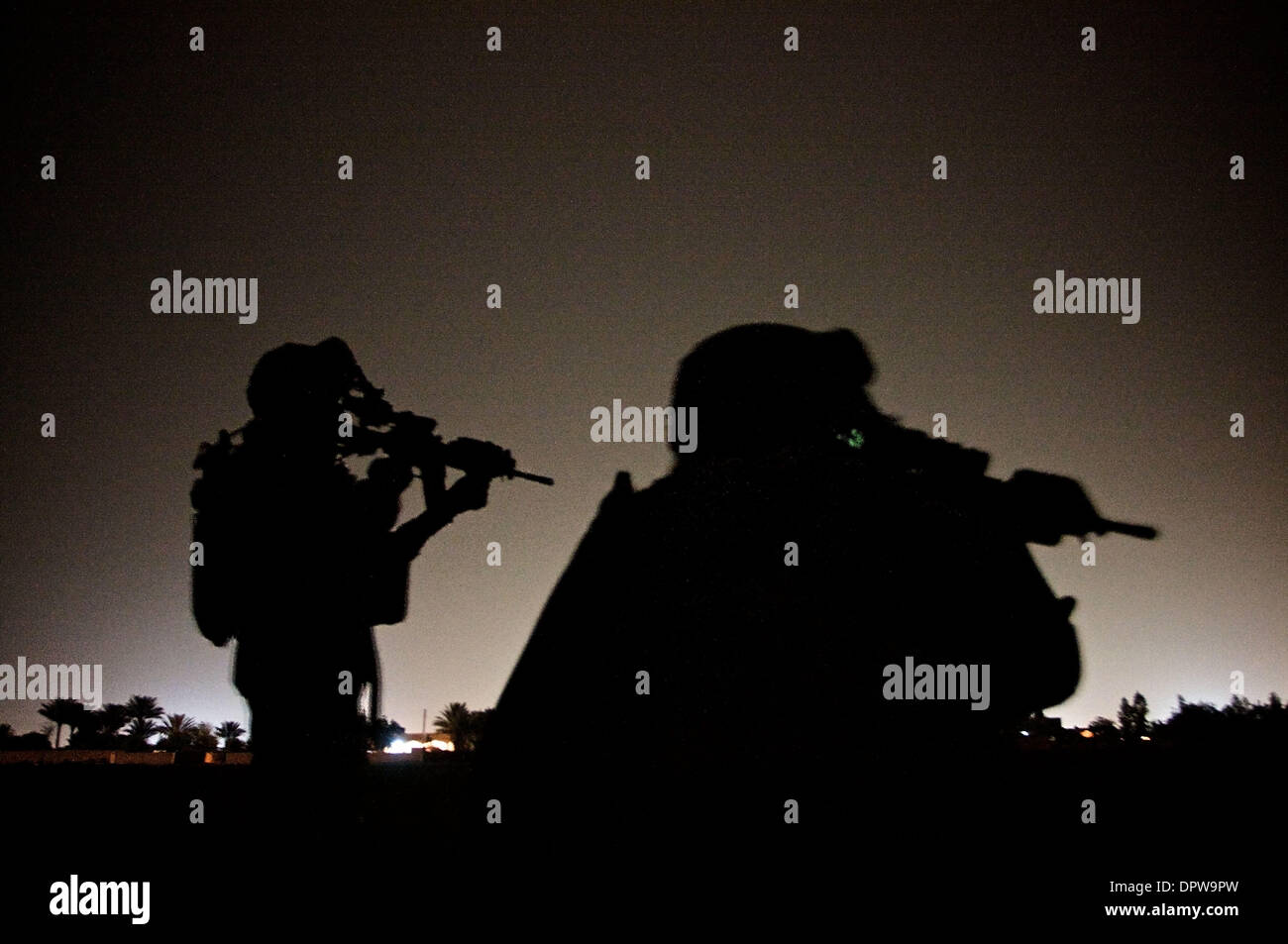 Mar 29, 2009 - Balad, Iraq - US Army SSG SIMMONS (left) and PCF COLEMAN (right) from from Comanche Troop, 3-4 CAV, 3IBCT, 25th ID, patrol south of Balad for insurgents attempting to fire mortars at coalition forces. (Credit Image: © John Goodman/ZUMA Press) Stock Photo