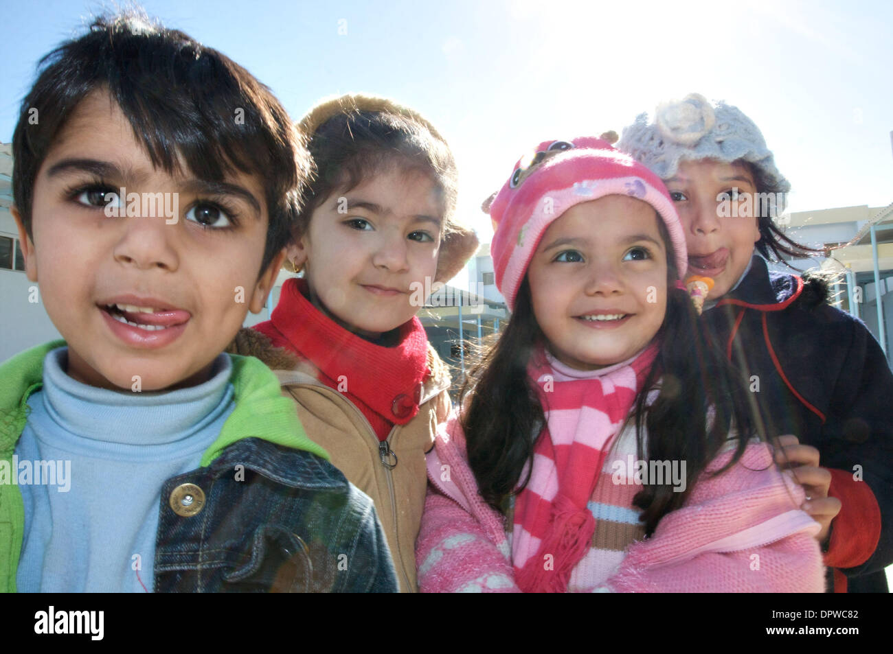 Jan 04, 2009 - Baghdad, Iraq - Children greet U.S. Army soldiers at a school in Baghdad while the soldiers were checking on the status of a school renovation which they are coordinating with Iraqi contractors. (Credit Image: © John Goodman/ZUMA Press) Stock Photo