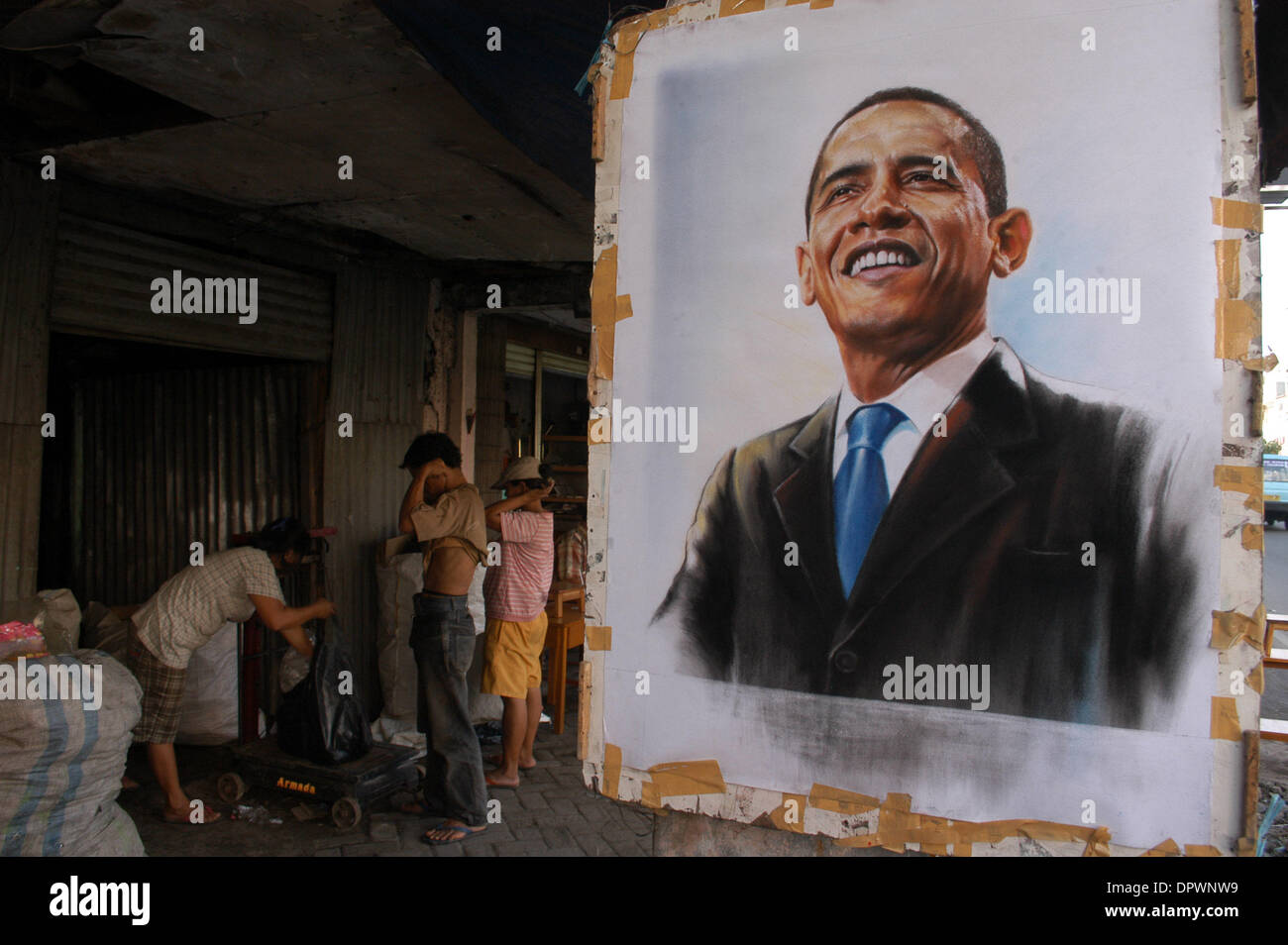Jan 20, 2009 - Jakarta, Indonesia - A street painter paints a picture of US President Barack Hussein Obama at a vendor in Jakarta, Indonesia, January 20.2009. Barack Hussein Obama claimed his place in history as America's first black president, summoning a dispirited nation to unite in hope against the 'gathering clouds and raging storms' of war and economic woe. (Credit Image: © J Stock Photo