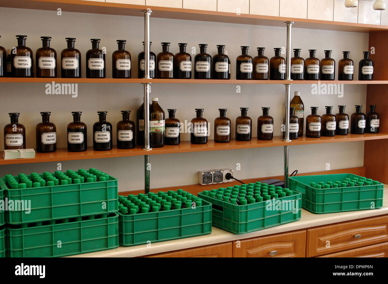 Glass bottles with herbal medicines standing on a shelf rack in the Knights Hospitallers pharmacy on May 2, 2011 in Krakow, Poland Stock Photo