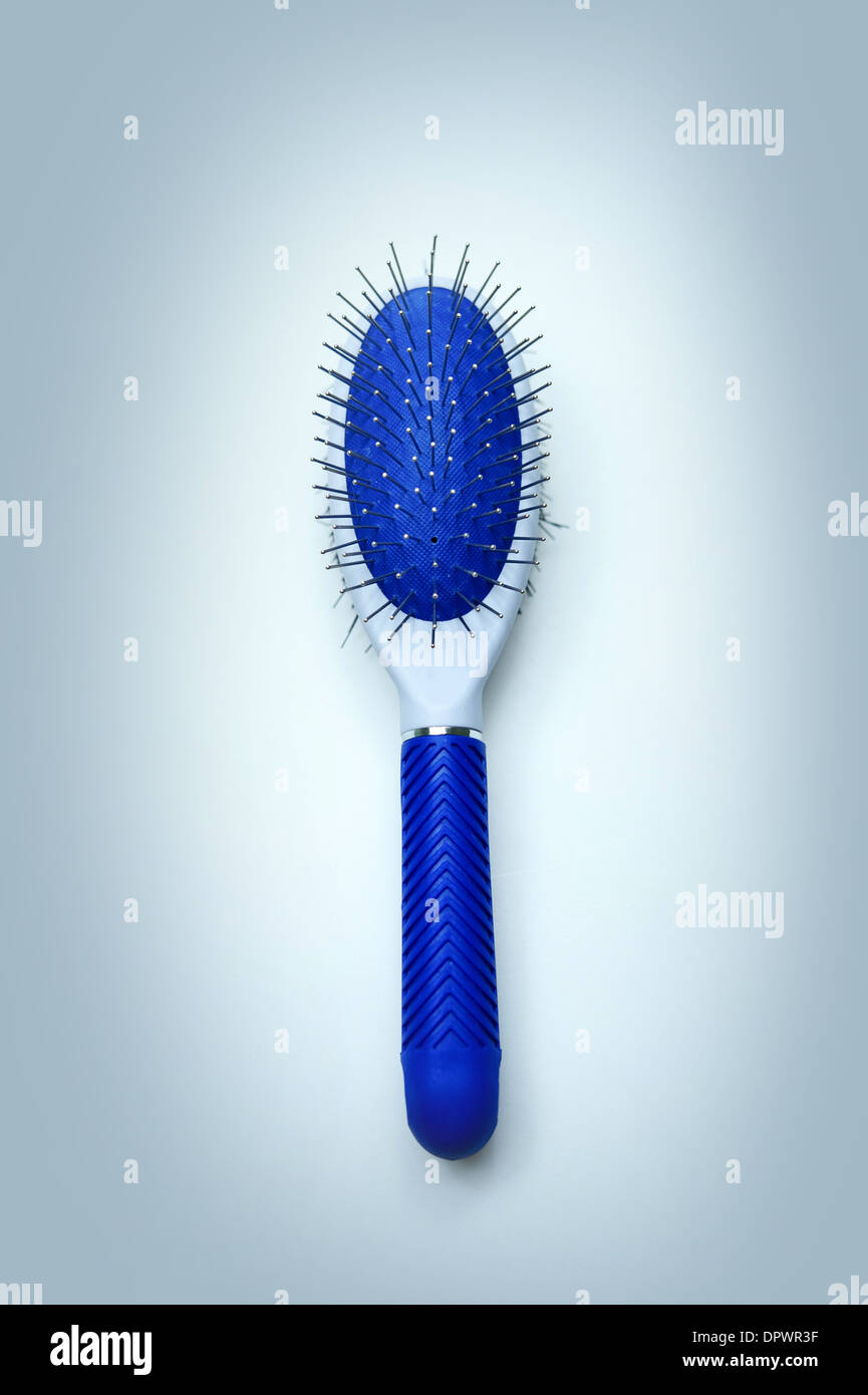 Hair Brush Isolated - Top View. Light Blue Background. Stock Photo