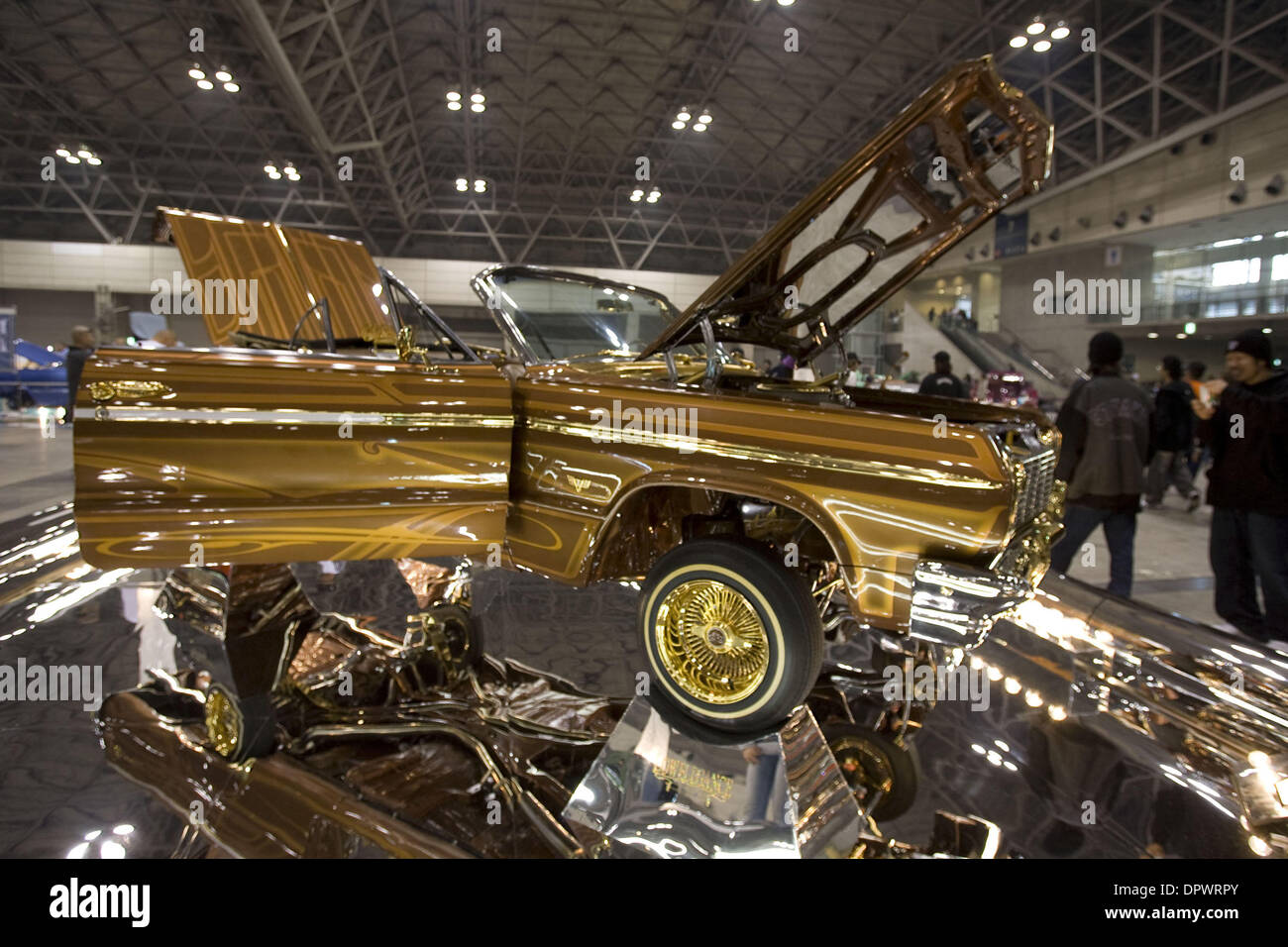Nov 25, 2008 - Chiba, Japan - Customized classic cars showcasing the American lowrider culture are displayed at the Lowrider Japan Car Show which took place at Makuhari Messe Convention Center in Chiba, Japan. Pictured: A heavily modified Chevy Impala with gold trimmings. (Credit Image: © Christopher Jue/ZUMA Press) Stock Photo