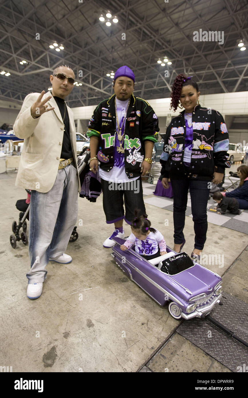 Nov 25, 2008 - Chiba, Japan - Customized classic cars showcasing the American lowrider culture are displayed at the Lowrider Japan Car Show which took place at Makuhari Messe Convention Center in Chiba, Japan. Pictured: Japanese fans pose for a picture at the Lowrider Japan Car Show. (Credit Image: © Christopher Jue/ZUMA Press) Stock Photo