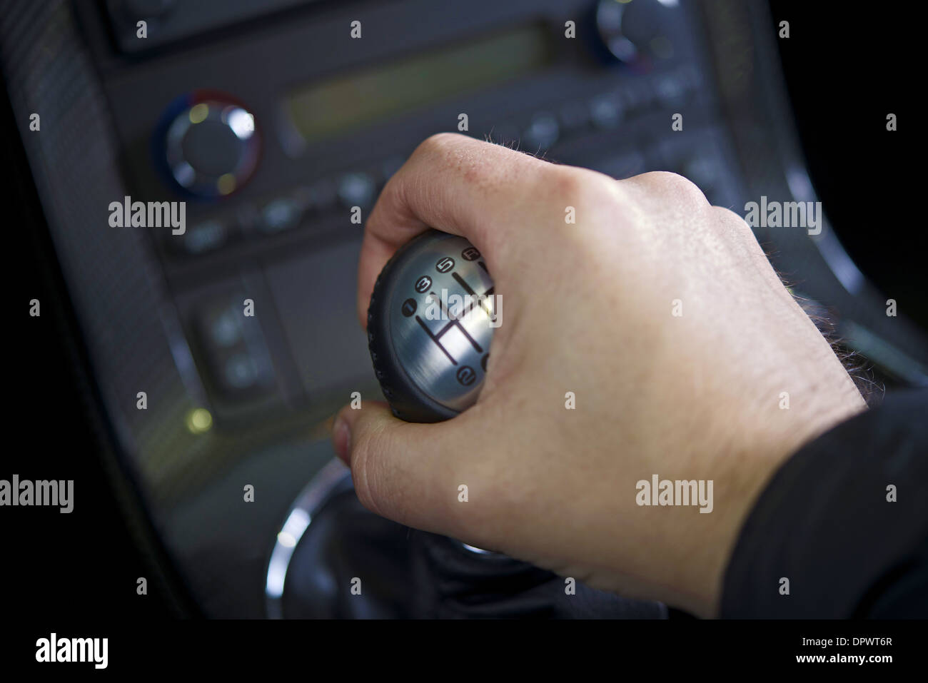 Driving Stick Shift - Hand on the Stick. Manual Car Transmission. Transportation Collection. Stock Photo
