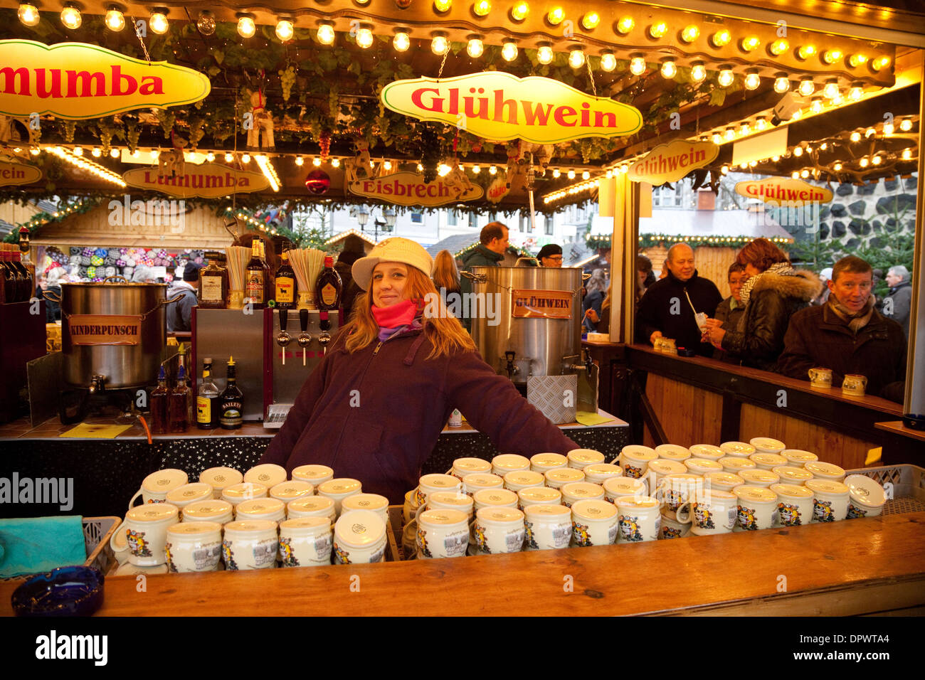 Gluhwein stall, mulled wine for sale with stallholder, at the Stock