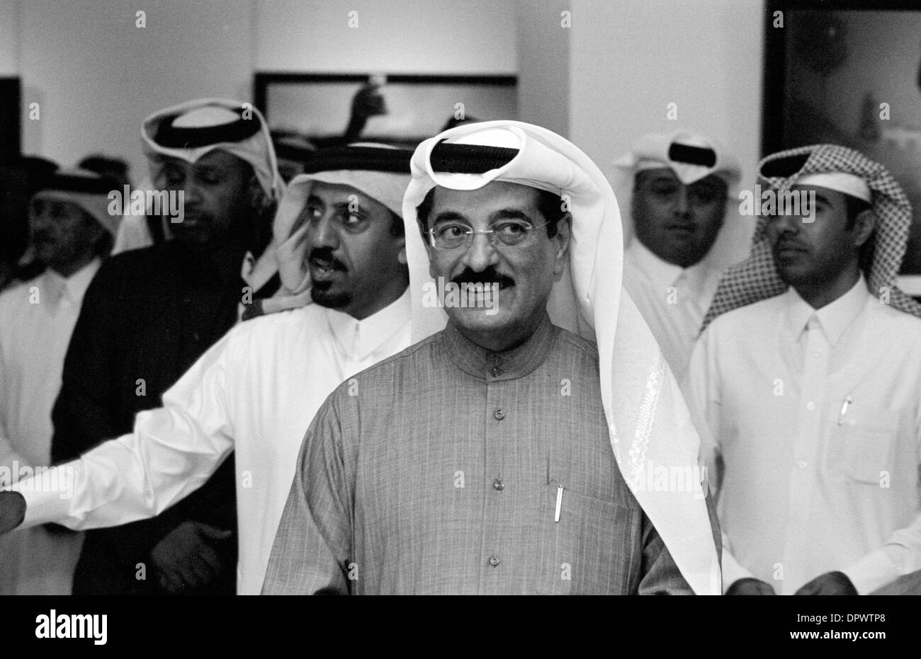Doha, Qatar - Jan 15, 2014: Qatari Minister of Arts Culture and Heritage, HE Dr Hamad bin Abdulaziz al-Kuwari (centre),talks to club officials at the ‘Simply Beautiful’ National Geographic Photo Exhibition, hosted by Qatar Photographic Society, at Katara cultural village in West Bay.  The minister's daughter, Iman, was co-owner of the Gympanzee nursery in Villagio Mall, Doha, where a tragic fire killed 19 people, including 13 children, in May 2012 Stock Photo
