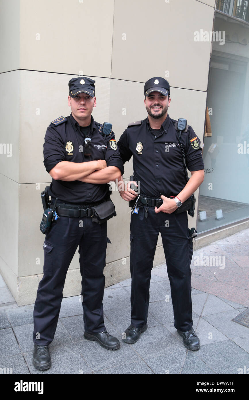 Two National Police Force Police officers (Policia Cuerpo Nacional de Policía or CNP) Seville (Sevilla), Andalusia, Spain. Stock Photo