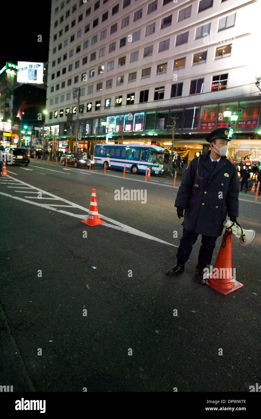 Dec 31, 2008 - Tokyo, Japan - A Japanese policeman directs traffic during the Japan New Years Eve countdown in the Roppongi district of Tokyo. (Credit Image: © Christopher Jue/ZUMA Press) Stock Photo
